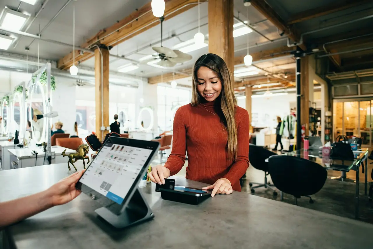 Retail customer service representative assisting a shopper